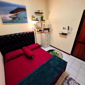 Postel nebo postele na pokoji v ubytování Ardian House Jepara
