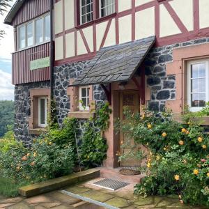 a house with flowers in front of it at Villa Christina in Lindenfels