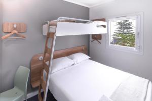 Postel nebo postele na pokoji v ubytování SUN1 PORT ELIZABETH