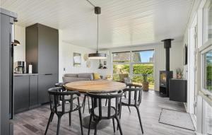 a kitchen and dining room with a table and chairs at Stunning Home In Bogense With Wifi in Bogense