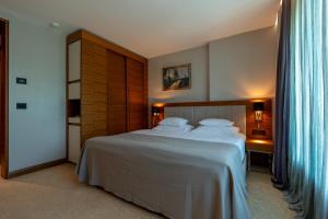 Posteľ alebo postele v izbe v ubytovaní Hotel Tonanti