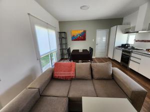 a living room with a couch and a table at Casa Francisco in Paraná