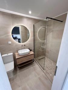 a bathroom with a toilet and a sink and a shower at Ocean View Studios and Luxury Rooms in Plomari +114 photos