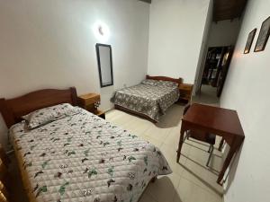 Letto o letti in una camera di Casa Lisieux- Jericó