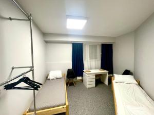 Postel nebo postele na pokoji v ubytování Central Hostel Jelgava