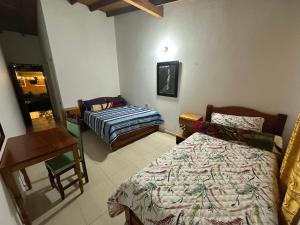 Letto o letti in una camera di Casa Lisieux- Jericó