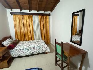 Letto o letti in una camera di Casa Lisieux- Jericó