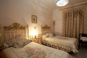 מיטה או מיטות בחדר ב-Hostal Jiménez