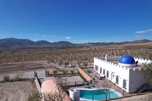 a house with a blue dome on top of it at Casa Fuente del Andaluz in Oria