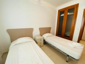 A bed or beds in a room at Euromarina Lateral by Alina365