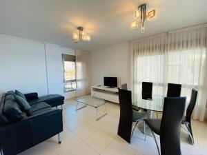 A television and/or entertainment centre at Euromarina Lateral by Alina365