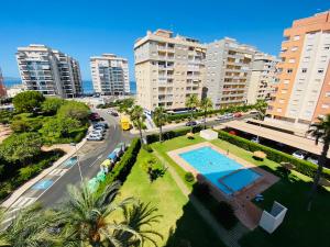 an aerial view of a city with a pool and buildings at Jardines de Veneciola by Alina365 in La Manga del Mar Menor