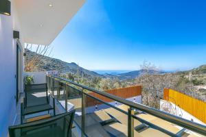 a balcony with a view of the mountains at Villa Yeşim in Kas