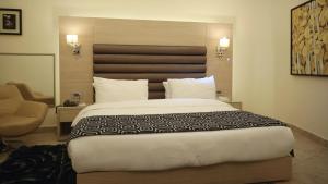 Ein Bett oder Betten in einem Zimmer der Unterkunft Hotel Xperience
