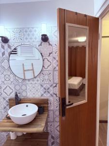 a bathroom with a sink and a mirror at Le Ti Marinois 5 in Le Marin +20 photos
