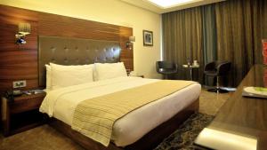 Ein Bett oder Betten in einem Zimmer der Unterkunft Hotel Xperience