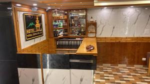 a bar in a restaurant with a counter at Hotel Middle Temple Pvt Ltd in Kathmandu