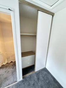 a room with a closet with a mirror at Home for 4 In rural Stoke prior 5 mins off the M5 in Stoke Prior