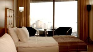 Ein Bett oder Betten in einem Zimmer der Unterkunft Hotel Xperience