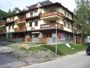 a building on the side of a street at Horec Apartment 2 in Donovaly