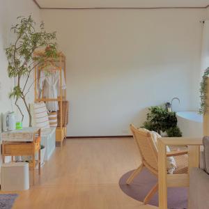 a room with chairs and a white wall with plants at Wintery House in Ban Thung Phan Ha +52 photos