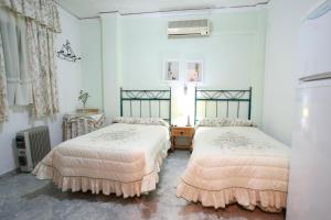 מיטה או מיטות בחדר ב-Hostal Jiménez