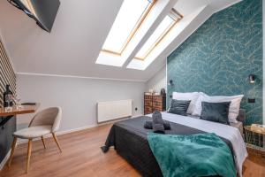 Posteľ alebo postele v izbe v ubytovaní Kościelna Loft Apartaments