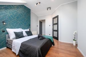 Posteľ alebo postele v izbe v ubytovaní Kościelna Loft Apartaments