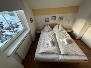 Postel nebo postele na pokoji v ubytování Fewo-Obertauern Maisonette + 5 fotografií