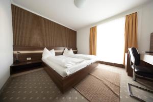 Posteľ alebo postele v izbe v ubytovaní Primus Hotel & Apartments