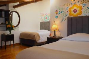 Postel nebo postele na pokoji v ubytování Cusco Lodge Hotel Boutique