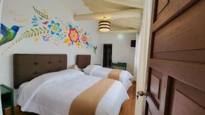 Postel nebo postele na pokoji v ubytování Cusco Lodge Hotel Boutique