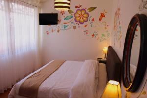 Postel nebo postele na pokoji v ubytování Cusco Lodge Hotel Boutique