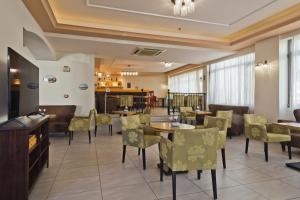 Posezení v ubytování Regina Studios & Hotel