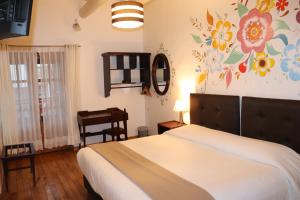 Postel nebo postele na pokoji v ubytování Cusco Lodge Hotel Boutique
