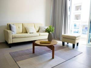 a living room with a couch and a coffee table at Casabeleza Cape Verde in Assomada