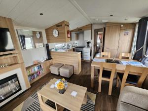 a living room and kitchen of a recreational vehicle at Heidi 2 Bed Robin hood in Rhyl