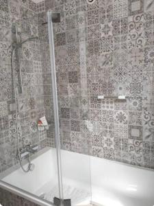 a shower in a bathroom with a glass shower backdoor at Le Galet in Saint-Dyé-sur-Loire