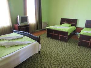 Postel nebo postele na pokoji v ubytování Guest House Nona