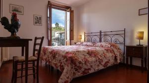 Posteľ alebo postele v izbe v ubytovaní Albergo Giovanni Da Verrazzano