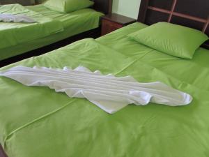 Postel nebo postele na pokoji v ubytování Guest House Nona