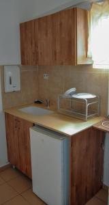 a kitchen with a sink and a counter at City Center Apartments in Haifa