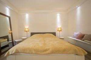 Ένα ή περισσότερα κρεβάτια σε δωμάτιο στο Comfort Suite Jelenovac