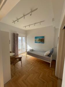 a bedroom with a bed in the middle of a room at Cozy apartment near metro-Athens view in Athens