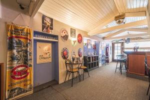a room with posters on the walls of a restaurant at Bar à Bulles - Ancien Comptoir Transformé in Reims
