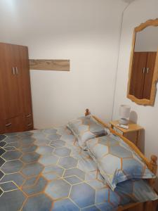 Ένα ή περισσότερα κρεβάτια σε δωμάτιο στο B&B Nina