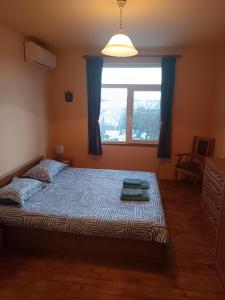 Ένα ή περισσότερα κρεβάτια σε δωμάτιο στο B&B Nina
