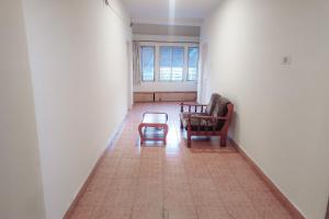 a living room with a couch and a table at Hotel Rainbow near Victoria Hospital City Market in Bengaluru +20 photos