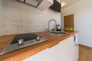 a kitchen with a sink and a counter top at Verde House in Karwia +49 photos