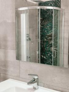 a bathroom with a sink and a mirror at Hotel Maremola in Pietra Ligure +101 photos